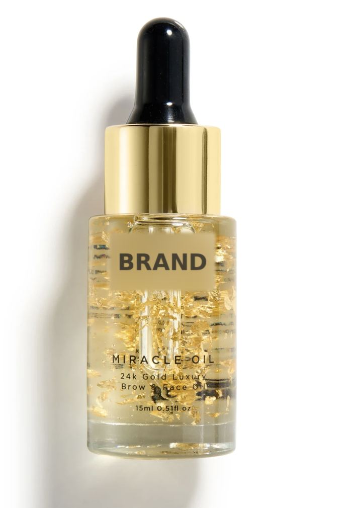 Gold flake face oil bottle on white