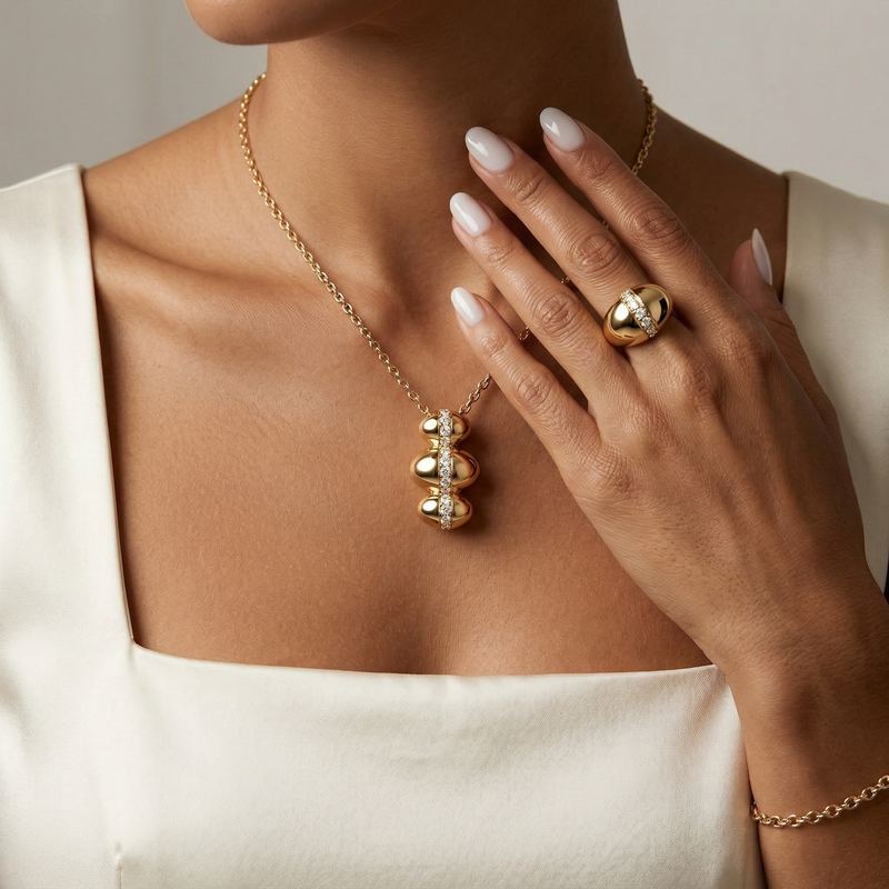 Same pendant and matching ring worn by a model