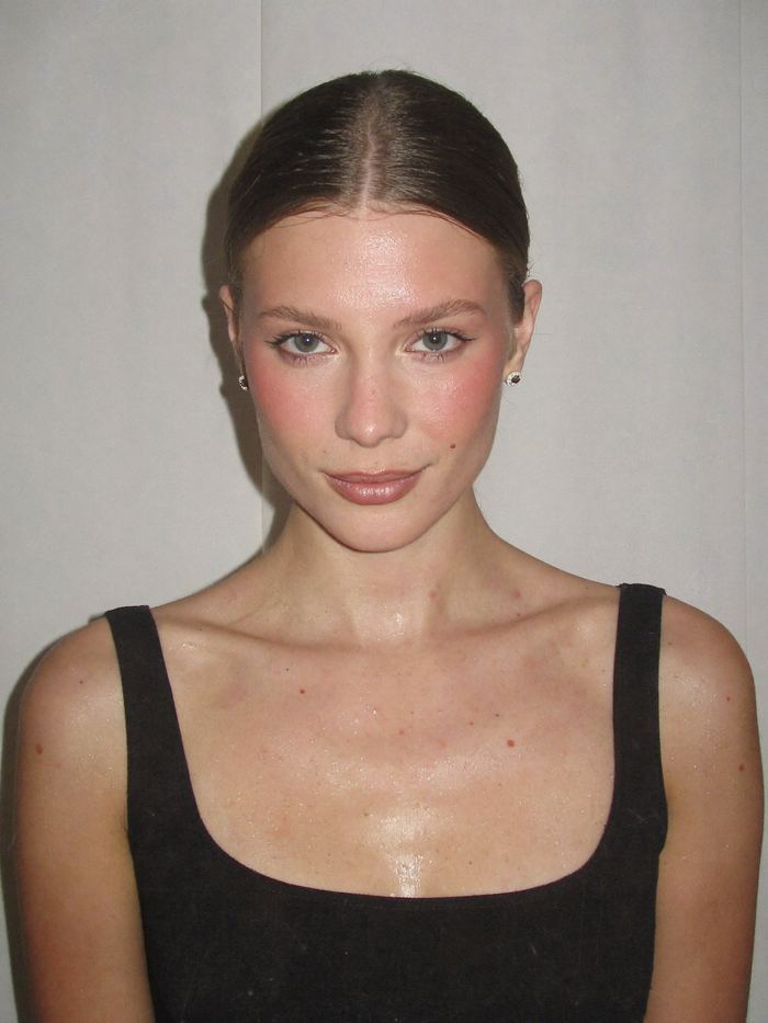 Beauty portrait with dewy skin and flash