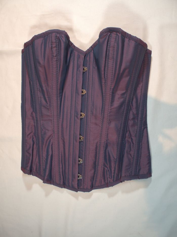 Iridescent corset photographed flat