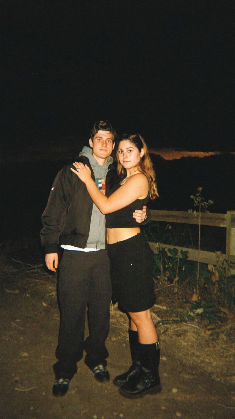 UGC style flash film photo of a couple at night