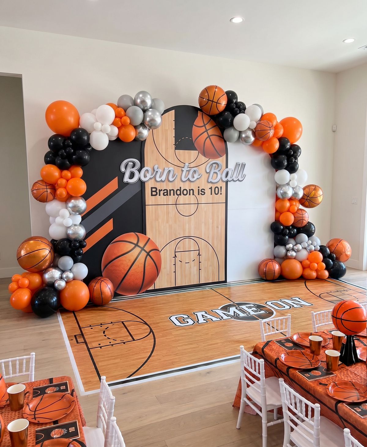 Basketball themed birthday backdrop with balloon garland